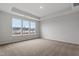 Spacious main bedroom with neutral carpeting and large windows at 1042 Westerland Way # 213, Durham, NC 27703