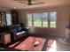 Bright living room with large window and comfortable seating at 113 E Laramie Dr, Mebane, NC 27302