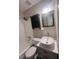 Clean bathroom, updated vanity, and new lighting at 141 Jones Franklin Rd # G, Raleigh, NC 27606