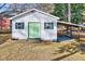 Detached workshop with green door and carport at 301 E Lewis St, Four Oaks, NC 27524