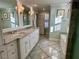 Elegant bathroom with double vanity, marble flooring, and a large soaking tub at 316 Tenney Cir, Chapel Hill, NC 27514