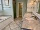 Luxurious bathroom with double vanities, marble countertops, and a soaking tub at 316 Tenney Cir, Chapel Hill, NC 27514