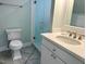 Modern bathroom with a glass shower, marble vanity, and tiled floor at 316 Tenney Cir, Chapel Hill, NC 27514