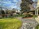 Stone walkway leading to charming home's entrance, surrounded by lush landscaping at 316 Tenney Cir, Chapel Hill, NC 27514