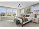 Spacious main bedroom with large windows, a metal bed frame, and soft color scheme at 35 Honeydew Way # 134, Clayton, NC 27520