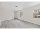 Spacious living area with vinyl plank flooring, coat closet and view to backyard at 409 Avery Street St, Garner, NC 27529