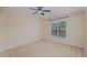 Bedroom with large window and ceiling fan at 4911 Stockton Way, Durham, NC 27707