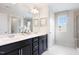 Elegant bathroom with double vanity and dark cabinetry at 502 Winter Wren Ln, Durham, NC 27703