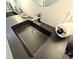 Black sink with chrome faucet in a modern bathroom at 5705 Katha Dr, Holly Springs, NC 27540