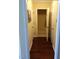 Hallway with dark hardwood floors and neutral walls at 9908 Grettle Ct, Raleigh, NC 27617