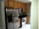 Kitchen features stainless steel appliances and wood cabinets at 9908 Grettle Ct, Raleigh, NC 27617