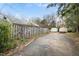 Spacious backyard with storage sheds and a wooden fence at 100 E Rockway St, Durham, NC 27704