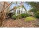 White house exterior with landscaping and a wooden fence at 100 E Rockway St, Durham, NC 27704