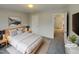 Virtually staged bedroom with built-in shelving and a view of the hallway at 113 Crosswind Dr, Cary, NC 27513