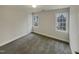 Spacious bedroom with gray carpeting and large windows at 113 Crosswind Dr, Cary, NC 27513