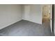 Simple bedroom with grey carpet and access to a hallway at 113 Crosswind Dr, Cary, NC 27513