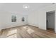 Bright bedroom featuring hardwood floors and a closet at 123 E Weatherspoon St, Sanford, NC 27330