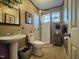 Bathroom with pedestal sink, shower, and tiled floor at 1534 S Hollybrook Rd, Wendell, NC 27591