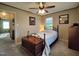 Comfortable bedroom with ceiling fan and access to another room at 1534 S Hollybrook Rd, Wendell, NC 27591