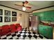 Retro kitchen with teal cabinets, checkerboard floor, and stainless steel appliances at 1534 S Hollybrook Rd, Wendell, NC 27591