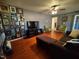 Bright living room featuring hardwood floors, sectional sofa, and two accent chairs at 1534 S Hollybrook Rd, Wendell, NC 27591