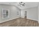 Main bedroom with vaulted ceiling, wood flooring, and ceiling fan at 203 Brickwell Way, Youngsville, NC 27596