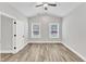 Spacious bedroom featuring wood floors and a ceiling fan at 208 Brickwell Way, Youngsville, NC 27596