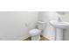 Small half bathroom with pedestal sink and toilet at 208 Leven Dr, Gibsonville, NC 27249