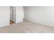 Well-lit bedroom with carpet and access to bathroom at 208 Leven Dr, Gibsonville, NC 27249