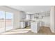 Modern kitchen with gray cabinets, granite counters, and island at 208 Leven Dr, Gibsonville, NC 27249