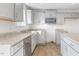 Modern kitchen with gray cabinets and granite countertops at 208 Leven Dr, Gibsonville, NC 27249