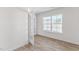 Bright office with wood-look flooring and french doors at 208 Leven Dr, Gibsonville, NC 27249