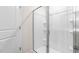 Clean shower with glass enclosure and built in shelving at 208 Leven Dr, Gibsonville, NC 27249