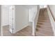 Carpeted staircase and wood flooring in hallway at 208 Leven Dr, Gibsonville, NC 27249