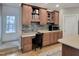 Built-in kitchen desk with wood cabinets and tile backsplash at 211 Black Tie Ln, Chapel Hill, NC 27514