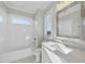 Modern bathroom with white tile and updated vanity at 235 Cottage Way, Pittsboro, NC 27312