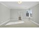 Spacious bedroom with large windows and door to hallway at 235 Cottage Way, Pittsboro, NC 27312