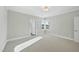 Bright bedroom with neutral decor and large windows offering natural light at 235 Cottage Way, Pittsboro, NC 27312