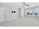 Light-filled bedroom with ceiling fan and neutral wall colors at 235 Cottage Way, Pittsboro, NC 27312