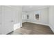 Bedroom with wood flooring, large windows and double doors at 235 Cottage Way, Pittsboro, NC 27312