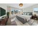 Main bedroom with large windows and plush bed at 235 Cottage Way, Pittsboro, NC 27312