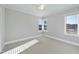 Well-lit bedroom with neutral walls and carpet flooring at 235 Cottage Way, Pittsboro, NC 27312