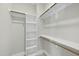 Large walk-in closet with shelves and hanging rods at 235 Cottage Way, Pittsboro, NC 27312