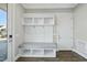 White entryway bench with storage and hooks at 235 Cottage Way, Pittsboro, NC 27312