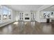 Bright living room with hardwood floors and a modern fireplace at 235 Cottage Way, Pittsboro, NC 27312