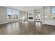 Living room featuring hardwood floors and a modern fireplace at 235 Cottage Way, Pittsboro, NC 27312