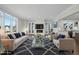 Spacious living room with fireplace, large windows, and comfortable seating at 235 Cottage Way, Pittsboro, NC 27312