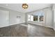 Spacious office with hardwood floors and natural light from large windows at 235 Cottage Way, Pittsboro, NC 27312