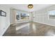 Bright home office features hardwood floors, large windows, and built-in shelving at 235 Cottage Way, Pittsboro, NC 27312