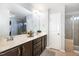 Double vanity bathroom with a large mirror and shower at , Durham, NC 27703